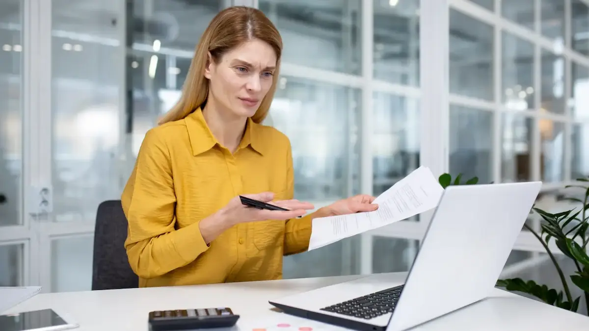 Frustrated property owner reviewing title documents during quiet title consultation